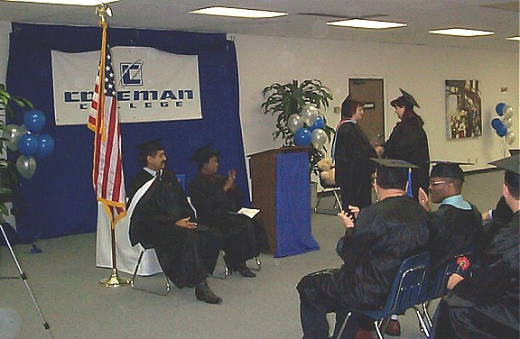 Diploma Handshake.jpg (73392 bytes)